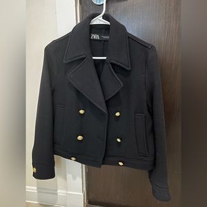 Navy Blue wool jacket with lapels and gold hardware.